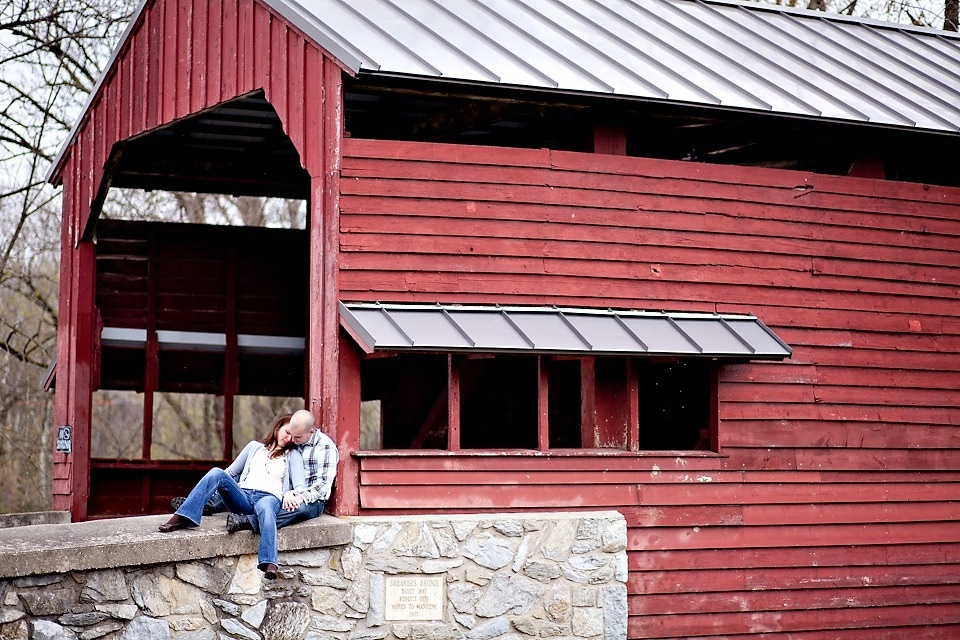 a couple on a covered bridge