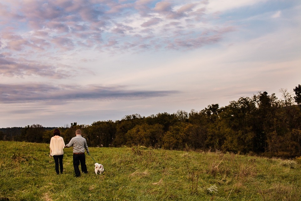 Couple walking in field at Blue Hound Farm, Lewisberry PA