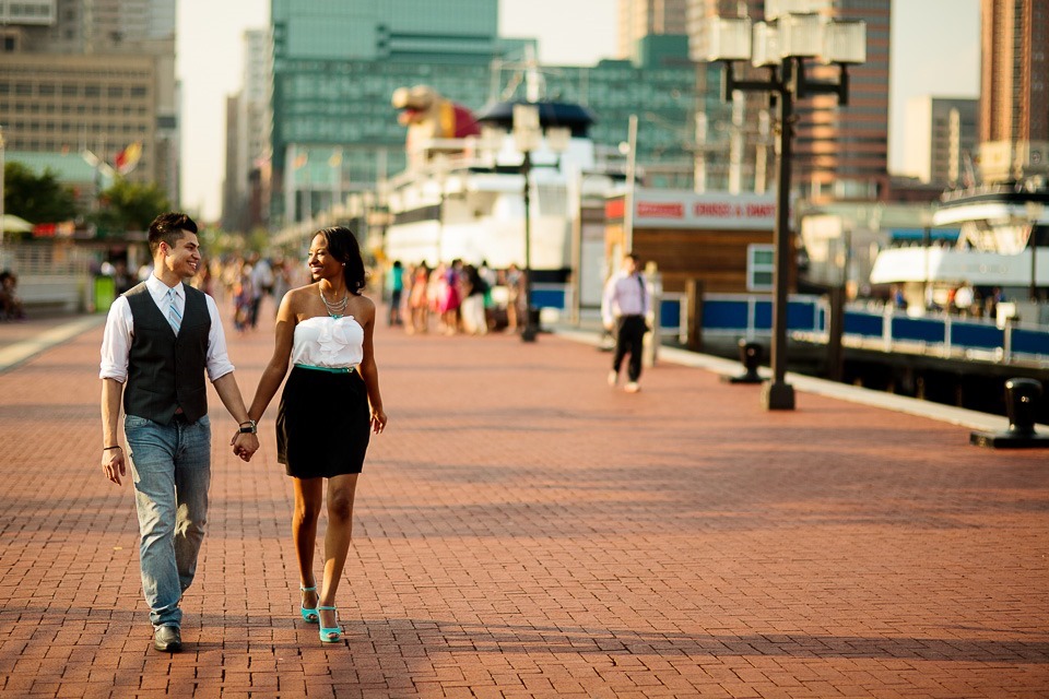 Couple walking along Inner Harbor in Baltimore Maryland